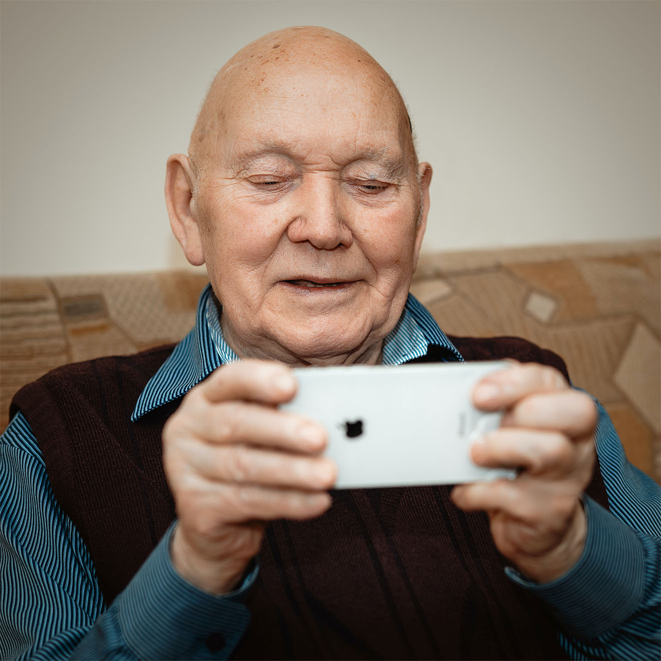 elderly man using a smart phone
