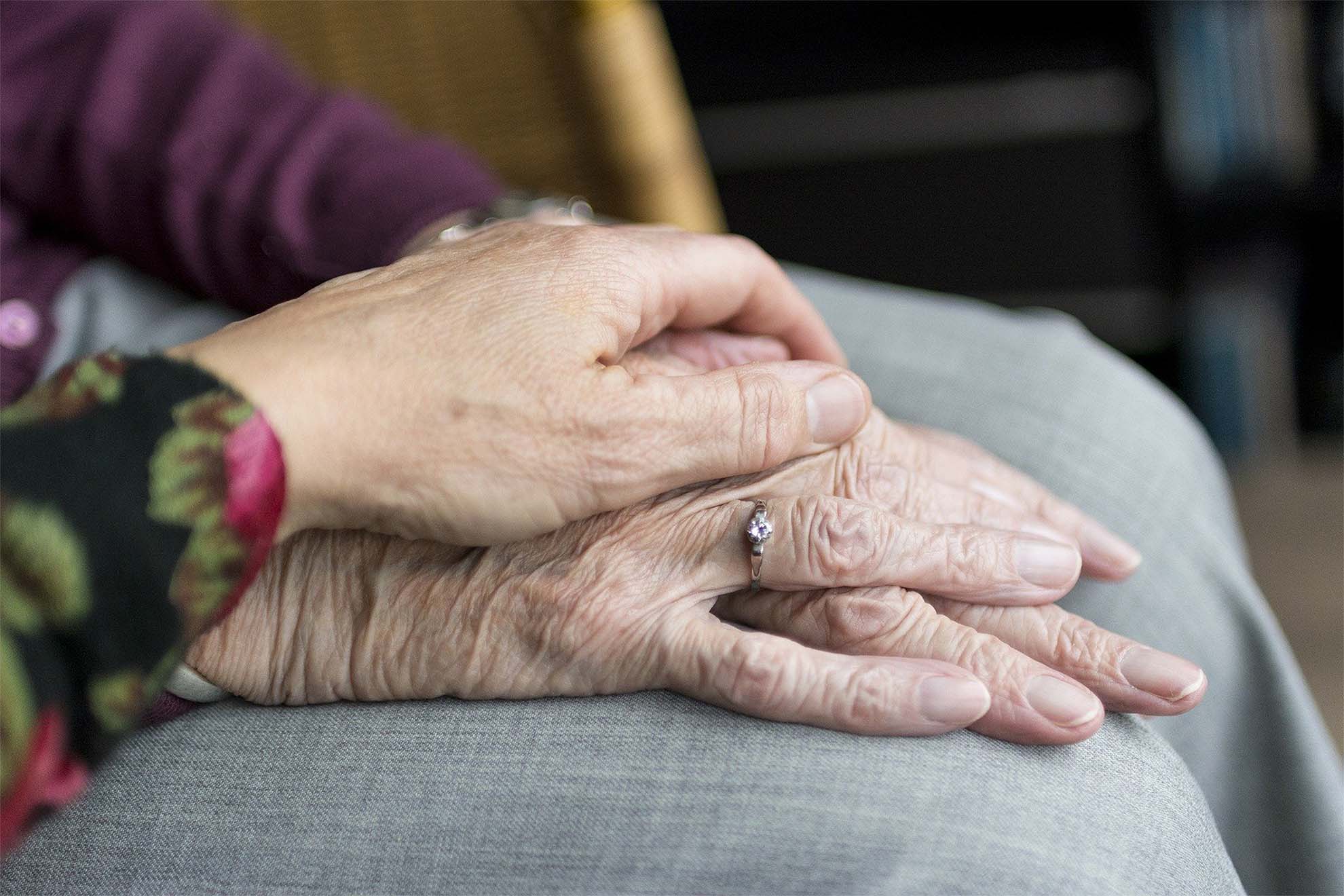 holding hands comfortingly