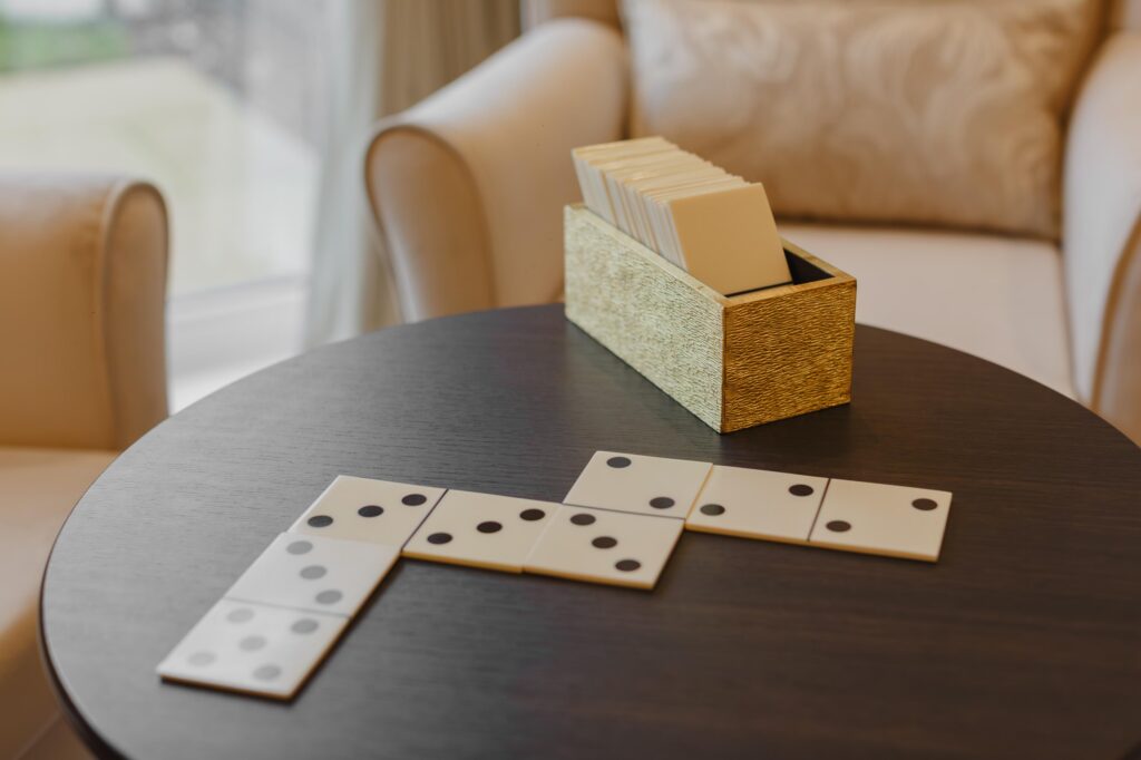 care home lounge table with dominoes game