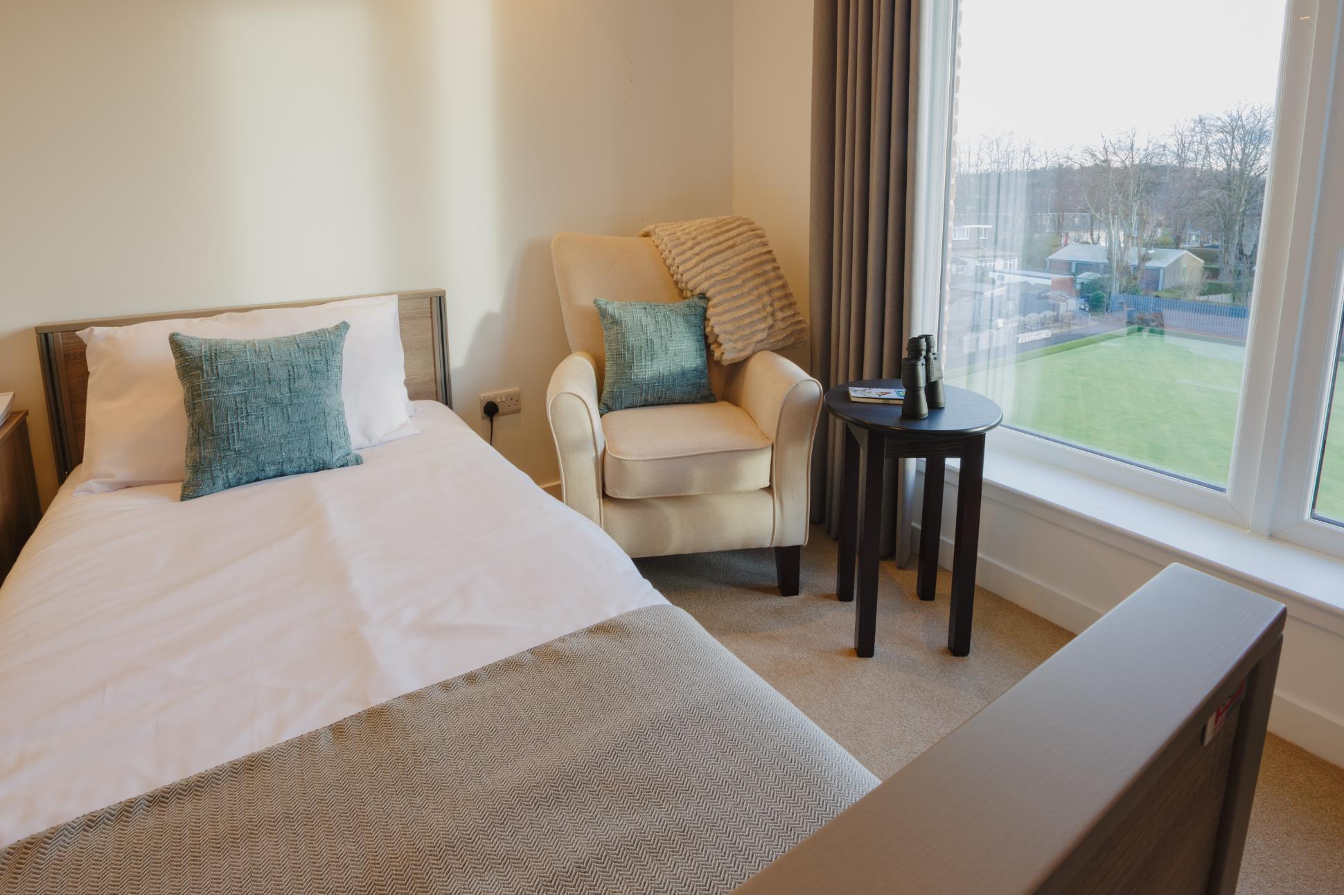 care home profiling bed with armchair