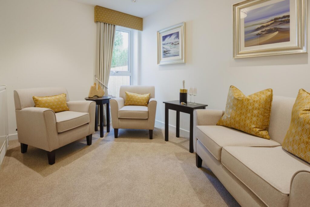 quiet room with cream sofas and yellow cushions