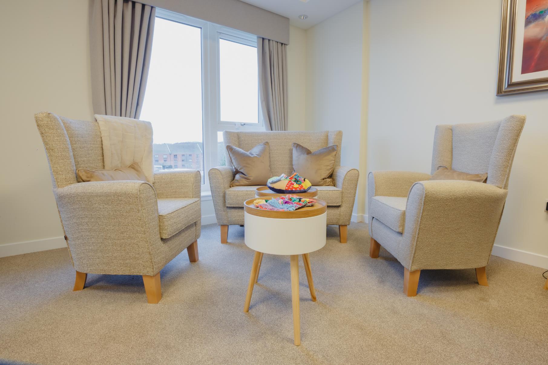 sensory room with calming cream decor and colourful games
