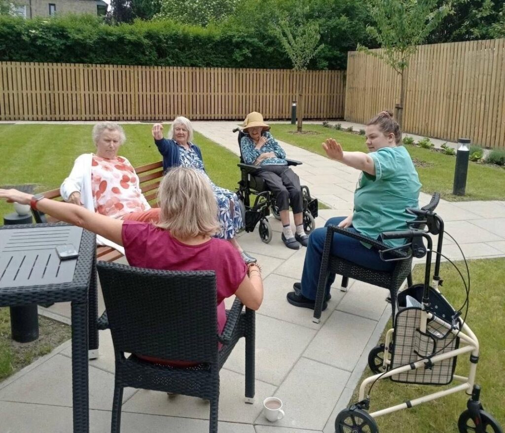 outdoor seated exercise activity in greenways care home in glasgow