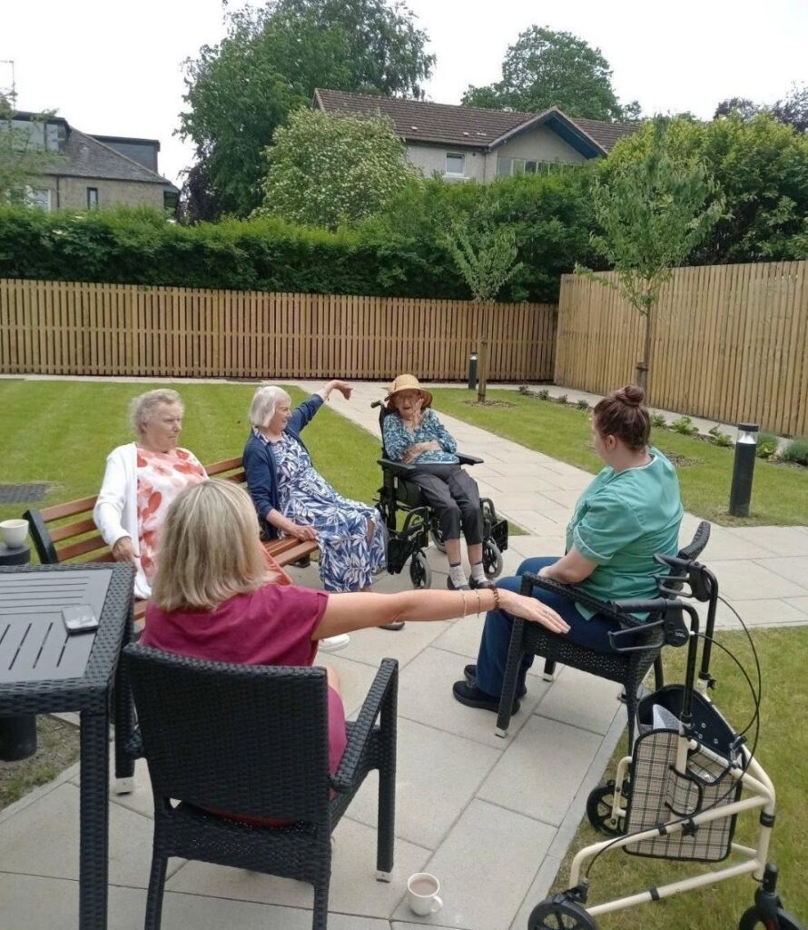 outdoor seated exercise activity in greenways care home in glasgow