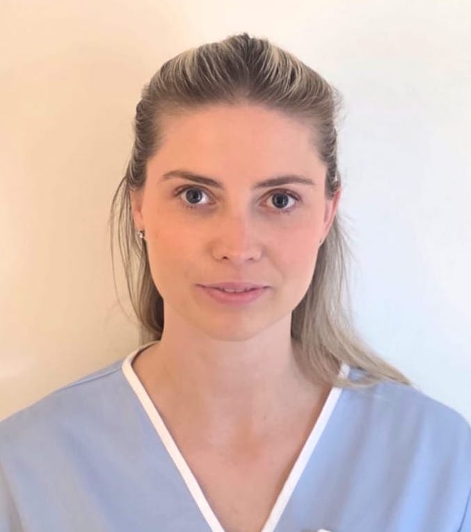 woman in a light blue nurses uniform