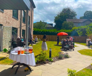 bbq garden party with guests and residents