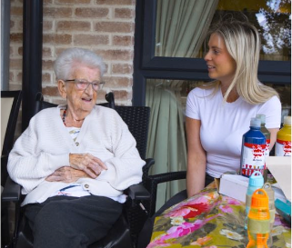 a residents laughing with a guest